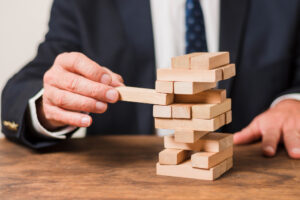 businessman-playing-jenga